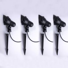 five black umbrellas are attached to the wall with one light on each side and three in the middle