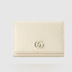 Elevate Your Style With This Stunning Gucci Gg Petite Marmont Textured-Leather Wallet In Ivory. Crafted From High-Quality Leather, This Wallet Is Perfect For Women Who Love To Keep Their Essentials In Style. It Features Multiple Credit Card Slots And Folds Easily, Making It A Versatile Addition To Your Accessories Collection. This Wallet Comes With Tags And Is Brand New, So You Can Be Assured Of Its Quality And Authenticity. The Iconic Marmont Theme Adds A Touch Of Sophistication And Elegance To Wallets Designer, Gucci Classic Wallets With Logo, Gucci Wallet With Gold-tone Hardware For Formal Occasions, Classic Gucci Wallet With Gold-tone Hardware, Gucci Wallets With Gold-tone Hardware For Formal Occasions, Elegant Gucci Wallet With Gold-tone Hardware, Bags Gucci, Gucci Wallet, Accessories Collection