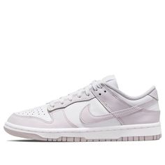 The highly anticipated Nike Wmns Dunk Low 'Venice' model has finally arrived and is ready to elevate your fashion game to the next level! This head-turner of a sneaker features a sleek white leather upper paired with light purple overlays for an eye-catching effect. Its signature Swoosh logo stands out on the side, completing the classic design. The woven tongue labels add an elegant touch that blends perfectly with the matching soles, setting these shoes apart from anything else you’ve seen bef Dunk Low Venice, Womens Dunk Low, Wmns Dunk Low, Dunk Low Nike, Air Shoes, Light Violet, Popular Sneakers, Nike Sb Dunks, Sb Dunk