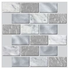 a white and grey tile wall