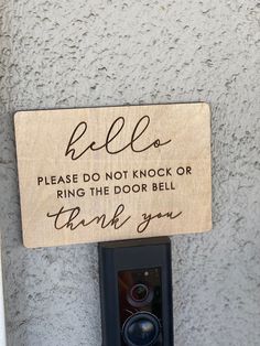 a sign that says hello please do not knock or ring the door bell thank you