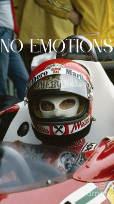 a close up of a person in a racing car with the words no emotions on it