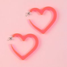 Big, playful, fluorescent pink heart shaped hoop earrings. Perfect for the Valentines holiday and large enough to see on a Zoom call! Made of light-weight acrylic and stainless steel earring posts. Available in fluorescent pink. Earring size: 2 x 1.9 x .25 Cute Pink Hoop Earrings For Valentine's Day, Pink Hoop Earrings For Valentine's Day, Playful Pink Heart Earrings For Valentine's Day, Pink Fun Hoop Earrings, Fun Pink Hoop Earrings, Trendy Pink Heart Earrings Pierced, Pink Earring, Shaped Hoop Earrings, Heart Hoop Earrings