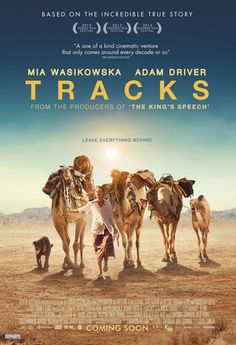 a movie poster for the film tracks with two men standing in front of three camels