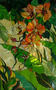 a stained glass window with flowers and leaves