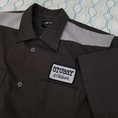 Vintage 90s Stussy Button Up Work Shirt Mechanic Shirt Gray Patch Workwear Stussy Worldwide Made In Usa Size Large Rare Shirt True Vintage From The 90s Made In Usa Awesome Stussy Patch On The Front Really Unique Piece Measurements: -Pit To Pit: 21.5 Inches -Collar To Bottom Seam: 29.5 Inches Retro Workwear Shirt With Snap Buttons, Luxury Vintage Workwear Shirt, Vintage Shirt With Pockets For Workwear, Stussy Workwear Jacket, Vintage Stussy T Shirts, Vintage Mechanic Shirt, Mechanic Shirt, Mechanic Shirts, Work Shirt