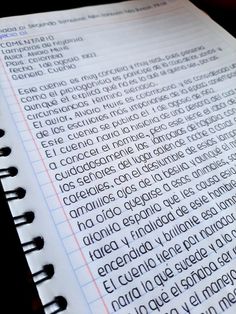 an open notebook with the words in spanish and english written on it's side