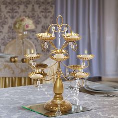 a gold candelabra with five candles on it