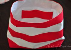 a red and white bag sitting on top of a wooden table