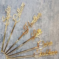 six personalized gold metal name pins with names on them