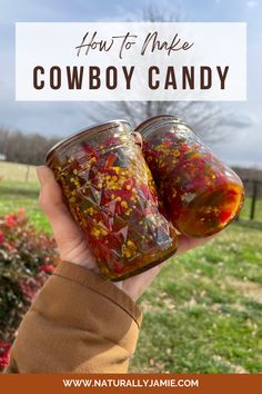 someone holding up two jars filled with candy