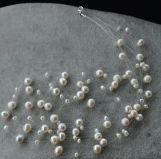 necklace length:17 -20 inches , necklace material: freshwater pearl pearl grade: AA+ clasp: sterling silver clasp pearl body: with blemish pearl luster: high pearl shape: off round pearl size: 3-8mm pearl colour: white packaging: beautiful pouch matching earrings: https://www.etsy.com/listing/99530522/ivory-pearl-earringsmultistrand-earrings matching bracelet: https://www.etsy.com/listing/92815741/genuine-pearl-braceletbabysbreath Thank you for your viewing. Color Illusion, Elegant Pearl Jewelry, Color Perla, Illusion Necklace, Ivory Pearl Necklace, Multi Strand Pearl Necklace, Genuine Pearl Necklace, Bridal Design, Pink Pearl Necklace