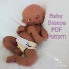 a baby doll laying on top of a white bed next to the words baby blanca pdf pattern