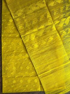 Pure Authentic Handloom Dhakai Jamdani Saree in yellow color Elevate your style with this Premium Quality Handwoven Dhakai Jamdani Saree. Handwoven with intricate detailing of needle jamdani work in Yellow thread, body in Yellow.  It offers a comfortable and luxurious feel along with the elegant and traditional look. Material: Halfsilk with Rice starch Type: Handloom Saree Design: Handwoven Jamdani Saree Length: 5. 5 meters Blouse: Not Included Care: Dry Wash Only Condition: New Care : Dry Clean Yellow Chikankari Embroidery Dupatta For Transitional Season, Yellow Saree With Chikankari Embroidery, Transitional Season Yellow Dupatta With Traditional Drape, Transitional Season Yellow Unstitched Saree, Unstitched Yellow Cutdana Saree, Unstitched Yellow Saree With Cutdana, Yellow Chanderi Traditional Wear With Cutdana, Yellow Cutdana Unstitched Saree, Yellow Unstitched Traditional Wear With Chikankari Embroidery