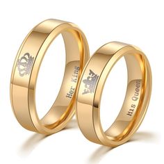 two gold wedding rings with the words his and hers engraved on each ring, set against a white background