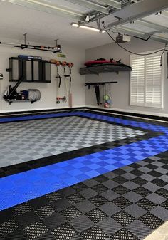 a garage with a blue and black checkered floor