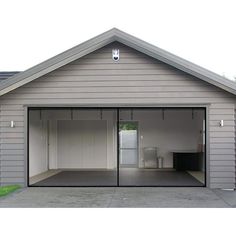 a garage with two doors open on the outside