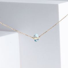 Description 10k yellow gold triangle aquamarine necklace, set in Januka's proprietary band setting. This beautiful light blue aquamarine sparkles like a lake's surface on a sunny day. Dainty and sophisticated for any occasions, whether it is business or casual. This necklace has a silicon adjuster at the back which allows you to shorten it to the length you desire to fit your look of the day.Band collection from Januka uses their proprietary setting method which tactfully carves each stone, so t Light Blue Aquamarine Gemstone Necklace, Light Blue Diamond Necklace For Anniversary, Light Blue Aquamarine Necklace Fine Jewelry, Fine Jewelry Light Blue Gemstone Necklace, Fine Jewelry Aquamarine Light Blue Necklace, Fine Jewelry Light Blue Aquamarine Necklace, Light Blue Fine Jewelry Necklace For Anniversary, Fine Jewelry Light Blue Birthstone Necklace, Light Blue Oval Gemstone Necklaces