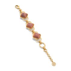 This versatile piece elevates the classic chain bracelet with an unexpected twist, artfully rendered with earthy teak beads and a subtly ornate gold motif for a dash of understated drama. Inspired by the effortless-yet-impeccable style that my fabulous French aunt achieves every day, who is able to take everything from a ballgown to a t-shirt, and make a moment of it. Pair with our Blandine Chain necklace to complete the look. Elegant Brown Jewelry With Adjustable Chain, Elegant Brown Chain Jewelry, Elegant Brown Jewelry With Chain, Elegant Brown Jubilee Bracelet, Elegant Brown Bracelet Jewelry, Elegant Brown Metal Beaded Bracelets, Chic Brown Bracelet Jewelry, Elegant Brown Beaded Bracelets, Gold Motif