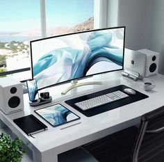 a computer monitor sitting on top of a white desk