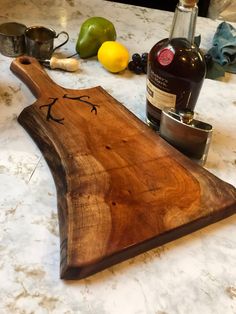 a wooden cutting board sitting on top of a counter