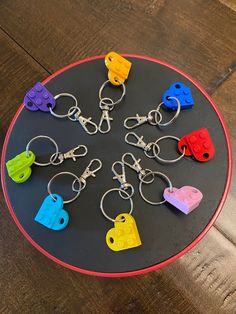 several lego keychains are arranged on a round table