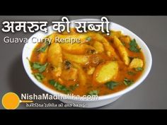 a bowl filled with curry and potatoes on top of a gray table next to a sign that reads guava curry recipe