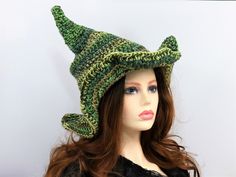 "This custom color forest witch hat is firmly shaped but soft enough to fold for travel. The brim is naturally wavy, but you can still play with where you want the waves to be exaggerated. The tip is sewn with a tuck to keep the point crooked, and the double thick yarn makes this hat firm enough to hang from a peg or sit on your dresser. You can add your own seasonal touch with pins, buttons, beads, flowers, etc through the crocheted stitching. This hat will take you through Fall, Winter, and Sp Handmade Witchy Hat With Curved Brim, Green Crochet Hat For Outdoors, Green Crochet Hat For Outdoor, Green Brimmed Sun Hat For Festival, Whimsical Hat With Curved Brim, Whimsical Brimmed Hat One Size, Bohemian Green Adjustable Costume Hats And Headpieces, Adjustable Green Bohemian Costume Hats And Headpieces, Whimsical One Size Brimmed Hat