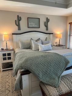 a bedroom with a large bed and two nightstands