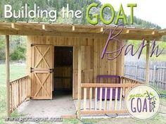 a wooden shed with the words building the goat bath