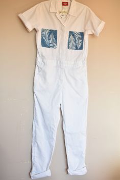 White Dickies Jumpsuit with Cyanotype fern print pocketsWomen fit with cinched waist in backTagged size M (see measurements)65% polyester 35% cottonTwo front pockets and two back pocketsZipper and snap buttons White Cotton Overalls With Relaxed Fit, Cotton Fitted Jumpsuits And Rompers With Pockets, Fitted Cotton Jumpsuits And Rompers With Pockets, Dickies Jumpsuit, White Dickies, Finger Crochet, Painted Denim, Leftover Fabric, Upcycled Fashion