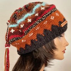 I Designed And Hand Knitted This Slouch,Beanie, Hat, Cap. Fair-Isle Style Hand Knit In Fall And Winter Rustic Shades. Top Of The Hat Has A Matching Colors Long Tassel Hanging . Warm, Cozy And Boho Chic ! Designed And Hand Knitted In California, Usa. See All Of My Original Designs Four Seasons Trendy Fine Hand Knits Listed Under “ Hand Knits 2 Love” In My Boutique: Poshmark.Com/Closet/Soheyla Brown Bohemian Beanie One Size, Black Bohemian Knitted Hat, Bohemian Brown Knitted Beanie, One Size Brown Knitted Hat, Bohemian Knitted Hats For Cold Weather, Bohemian Hats For Cold Weather, Bohemian Style Hats For Cold Weather, Slouch Beanie Hats, Hand Knits