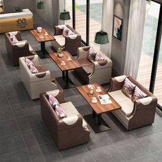 an overhead view of a restaurant with tables, chairs and couches on the floor