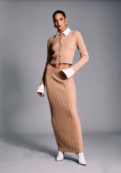 Cable knit midi skirt. Pair with our Eloise Cable Knit Cardigan for a co-ord look. Shown here in Tan. 45% Viscose, 28% Polyester, 21% Acrylic, 6% Wool Made in China Model is 5'10" wearing size S Style No. 4240-16 333 Project, Cable Knit Skirt, Fall Wardrobe Staples, Summer Neutrals, Deep Autumn, Feminine Fashion, Knit Outerwear, Knit Shoes, Romper And Jacket