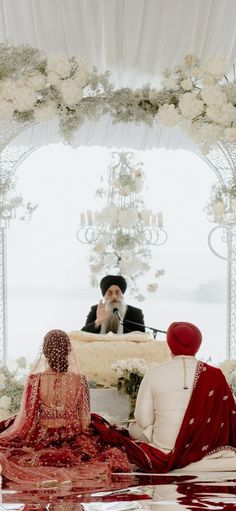 the bride and groom are sitting on their wedding day