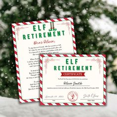 two red and white business cards sitting next to each other on top of snow covered ground