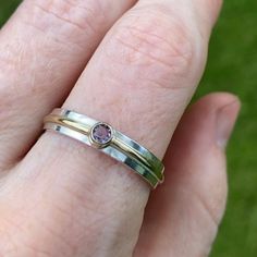 Very simple, clean and classy ring made from sterling silver, 14k gold, and an Alexandrite birthstone. Fabricated by hand, a ring shank is formed out of sterling silver rectangle wire by hammering and soldering. The artist's stamp is placed on the inside of the shank. A piece of 14 karat gold tubing is soldered to the shank along with a piece of 14 karat gold wire that is wraped around the shank. The fine silver is brought to the surface to remove firescale and prevent tarnishing. A 3mm Alexandr Modern Amethyst Birthstone Ring For Anniversary, Alexandrite Birthstone, Classy Ring, Ring Shank, Stone Wrapping, Wrap Ring, Gold Wire, Wrap Rings, Soldering