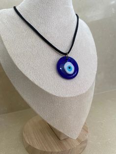 Made from quality glass and string. This evil eye necklace is said to repel negative energy such as jealousy, hatred, anger and fear, . The evil eye 'stare' is believed to bring bad luck to the person providing the negative energy or bad luck. This is a traditional belief that is meant to protect you from evil spirits. Provides a symbol of protection. Can be used for any event to bring good luck. The evil eye necklace is modern yet traditional in its belief. It makes a perfect gift to anyone. Symbole Protection, Glass Evil Eye, Turkish Eye, Necklace Cord, Black Rope, Bad Luck, Evil Eye Necklace, Evil Spirits, Cord Necklace