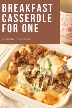 a casserole dish with meat and cheese in it is being eaten by a fork