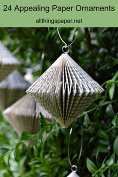 three paper ornaments hanging from a tree with text overlay that says, 24 appealing paper ornaments