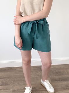 "Handmade washed linen loose shorts with pockets and elastic waist. Made with love for You. *100% local medium weight linen *Washed linen *Elastic waist *Each item is individually cut and sewn by order *The model is wearing size M, shorts color - Viridian blue *Note that colors may look different on your display depending on their settings and technical characteristics. Please let us know if you need different measurements or colors. CARE: *Machine wash up to 40 / 104F gentle cycle *Iron inside Casual Linen Shorts With Tie Waist, Green Linen Shorts With Pockets, Spring Green Linen Shorts, Green Linen Summer Bottoms, Green Linen Beach Shorts, Green Linen Summer Shorts, Wrap Dresses Summer, Linen Loose Dress, Loose Kimono