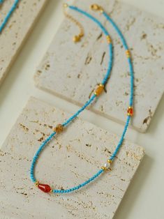 This stunning necklace combines blue turquoise and red onyx beads to create a charming multi-element design. With pearls and a variety of natural stones, each element has its own flavor, blue turquoise beads exude tranquility and sophistication, while red onyx adds a bold and vibrant touch. Each bead is carefully strung together, creating an elegant and versatile accessory suitable for any occasion. Metal: 18K Recycled Gold Plated On Brass/Recycled Sterling Silver Gemstone: Red Onyx/Multi Stone/ Element Design, Crafts Jewelry, Onyx Bead, Tiger Eye Stone, Diy Crafts Jewelry, Recycled Gold, Stunning Necklace, Recycled Sterling Silver, Multi Stone