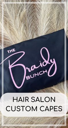 the brandy brunch hair salon logo on a black bag with feathers around it