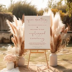 an easel with some pamodia in front of it and a sign that says welcome to our newly married ceremony