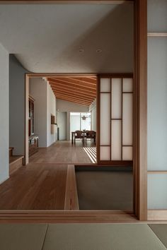 an empty room with wooden floors and sliding doors