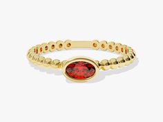 Make a bold statement with our beaded oval birthstone ring, customizable as gold, white gold, or rose gold. Offered in your choice of gold - 14k or 18k - this striking ring features a rich oval garnet gemstone set in a classic gold band, adding a touch of warmth and sophistication to your ensemble. Elegant Oval Ruby Stackable Ring, Oval Stackable Birthstone Ring In Fine Jewelry Style, Oval Birthstone Stackable Ring In Fine Jewelry Style, Fine Jewelry Stackable Oval Ruby Ring, Stackable Oval Ruby Ring In Fine Jewelry, Oval Ruby Ring Stackable For Formal Occasions, Yellow Gold Oval Birthstone Ring Stackable, Classic Oval Stackable Ruby Ring, Classic Oval Ruby Ring Stackable