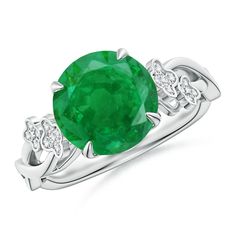 an oval emerald and diamond ring on a white background with the center stone surrounded by diamonds