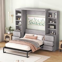 a bedroom with a bed, dresser and bookcases