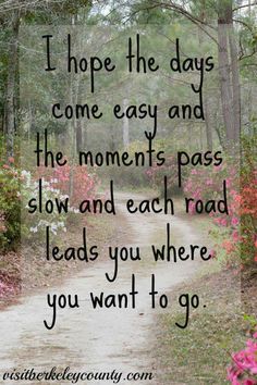 a dirt road surrounded by flowers and trees with the words, i hope the days come easy