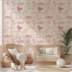 a baby's room with pink and white wallpaper